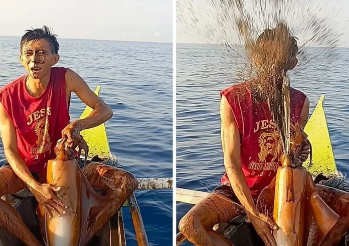 Viral στις Φιλιππίνες: Καλαμάρι «λούζει» με μελάνι ψαρά που ποζάρει στην κάμερα